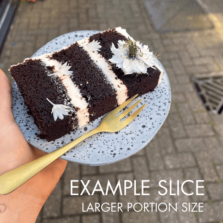 Slice of chocolate Guinness cake with cream cheese filling, three layer